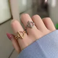 Detail van OT-gesp kettingringen in goud en zilver met micro-ingelegde diamanten - Verstelbaar Open / Goud