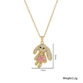 Golden rabbit pendant necklace with pink star stone and white zircons on white background - Rabbit / Gold