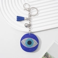 Blue Evil Eye keychain with sparkling rhinestones and blue tassel on silver metal hook - Royal Blue