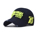 Detailed close-up of neon green 3D embroidery on dark blue cotton baseball cap with distressed brim - Adjustable / Navy Blue
