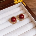 Vintage stud earrings with dark red stones and gold braided frames in a wood jewelry box - Round Wrapped Stud / Red