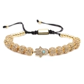 Verstellbares Hamsa-Armband aus schwarzer Kordel mit goldfarbenen Zirkonperlen und Türkis - Gold