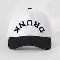 Detail of DRUNK 3D embroidery on a retro contrast color cotton baseball cap - White and Black Splicing