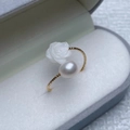 Elegant gold twisted ring featuring a white resin rose and a lustrous round pearl - Rose Shell