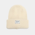 Close-up of thick beige knit beanie featuring AQER woven label and blue stitch detail - Beige