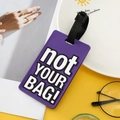 Purple PVC luggage tag with white 'not YOUR BAG!' text and black buckle strap attachment - Purple