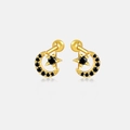 Dettaglio degli orecchini a stella e luna dorati con pietre nere e un riflesso elegante - Oro 18K/Zircone Nero