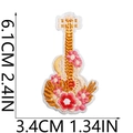 Detailed size view of flower guitar iron-on patch measuring 6.1cm by 3.4cm - Pink Flower Ukulele Style (No.16)