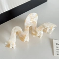 Elegant wavy hair claw clip in pearly white marble finish for chic hairstyling - Floral Orange