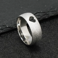 Macro detail of silver frosted stainless steel ring featuring heart cutout on the band - US 6 / Steel Color Hollow Heart (8mm)