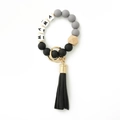 Detailed view of MAMA silicone bead keychain bracelet with grey beads and black tassel - Black