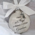 Memorial ornament for grandson featuring a white ball with ribbon and silver angel wing - Grandson