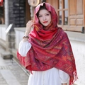 Ethnic style red tassel shawl scarf with vintage jacquard pattern worn by a model - Bright Red Paisley Ethnic Shawl