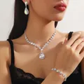 Detail of luxury teardrop AB crystal jewelry set worn by a model in studio lighting - Silver AB (DZ67)