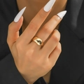 Close-up of polished gold dome ring on model hand with minimalist modern design - Shiny Gold Wide Dome