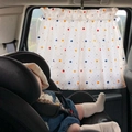 Car window sunshade with colorful polka dots protects baby in safety seat from sunlight - Colorful Polka Dots