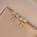 Golden bow stud earrings with sparkling cubic zirconia and dangling asymmetric fringe - Bowknot Tassel Style (E0375) / Gold