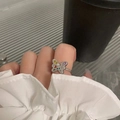 Silver butterfly ring with colorful cubic zirconia and heart motifs on finger - Adjustable Open / Butterfly Color Stone Style (J3729)