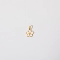 Detailed view of white enamel flower pendant with gold plated edges and center - Flower Pendant