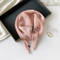 Detail of pink pleated silk scarf neatly arranged on a minimalist black tray with a card - 70*70cm / Pleated Pink