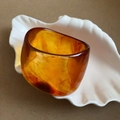 Irregular geometric resin bangle in amber brown finish with natural smoke texture - Brown