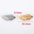 Détails de pendentifs ailes d'ange en or et argent avec dimensions de 8,5mm et 20,3mm - Aile d'ange simple / Couleur Acier