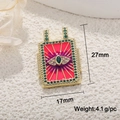 Detail of tarot evil eye pendant in gold finish with red enamel and dimensions 27mm x 17mm - Green Zirconia Pink Eye