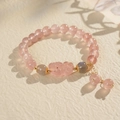 Close-up of strawberry quartz beaded bracelet with carved PiXiu and gold chain detail - 15# Moonstone Strawberry Quartz Pixiu Bracelet
