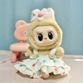 Labubu doll wearing beige plush outfit and pink flower accessory with heart dress - Yellow Dress With Pendant / First And Second Generation Keychains Are Compatible With La Cloth Dolls. Dolls Not Included.