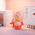 Pink robe Maitreya Buddha car ornament holding a gold ingot on a checkered desk - Holding Ingot Pose (Small Red)