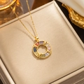 Golden heart necklace with round pendant featuring multicolor baguette gemstones - 316 Gold Colorful Donut