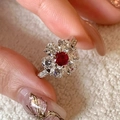 Vintage style silver ring with a central red ruby and small clear diamonds surrounding - Silver Ruby Center Surrounded by Clear Gemstone Ring (J5730)