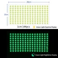 Luminous star wall stickers set of 144pcs showing day and green glow night effects - YG209 / 144 Stars (1cm)