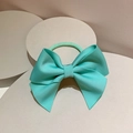 Detail of mint green ribbed ribbon bow hair tie displayed on a geometric stone base - Hair Tie / Mint Green