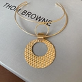 Double-layered gold collar necklace with a woven texture circular geometric pendant - Gold