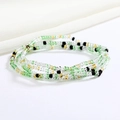 Handmade colorful glass seed bead body chain with green, gold and black elastic waist beads - Green Yellow Black Transparent