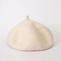 Close-up of wool texture and rounded shape on this beige minimalist beret hat - Adjustable / Beige