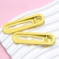 Pair of bright yellow 6cm U-shaped seamless metal hair clips with shiny lacquer finish - Yellow