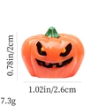 Detail view of orange Halloween pumpkin charm with size 2.6x2cm and weight 7.3g labels - Squinting Smiling Pumpkin