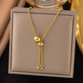 Detail of adjustable gold beaded box chain necklace with smooth slider clasp and round charms - Round Ball Pendant Necklace (XLH617) / Gold