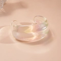 Close-up of chunky iridescent acrylic open cuff bangle with vibrant aurora glow - Double Layer