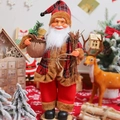 Detail view of a 12-inch standing Santa Claus doll in red plaid outfit for Christmas decor - Woodcutter Style / 45cm
