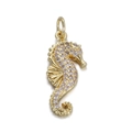 Detailed close-up of a gold-toned seahorse pendant with sparkling pink zircon stones - Pink Purple Seahorse/YSN088-07