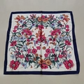 Off-white silk square scarf featuring vibrant floral prints and a dark blue border - Hundred Flowers Rice Handkerchief / 65