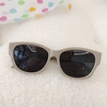 Retro khaki square frame kids sunglasses with dark lenses on a white plush background - Gray