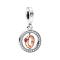 Detail of rotating rose gold heart charm with red zircon and silver pavé accents - Two-Tone Rotating Heart Pendant (PCT1155)