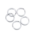 Set of five polished silver-colored metal keyrings on a white minimalist background - Rhodium