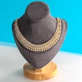Luxurious multi-row rhinestone choker necklace in gold finish on a velvet display - Small Dark Grey Velvet