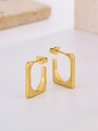 Macro shot of gold-plated oval egg-shaped hoop earrings on a minimalist stone surface - 3-Square Geometric Style
