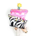 Detailed view of giant pink candle cake foil balloon with stylish zebra pattern base - Large Zebra Stripe Cake